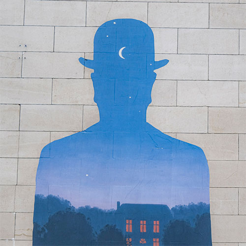 Photo of a Magritte painting on a wall